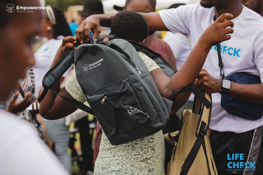 School bag handoff at LifeCheck Back to School