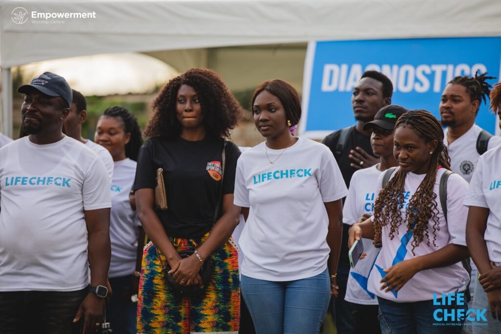 Large LifeCheck volunteer group in front of the diagnostics tent
