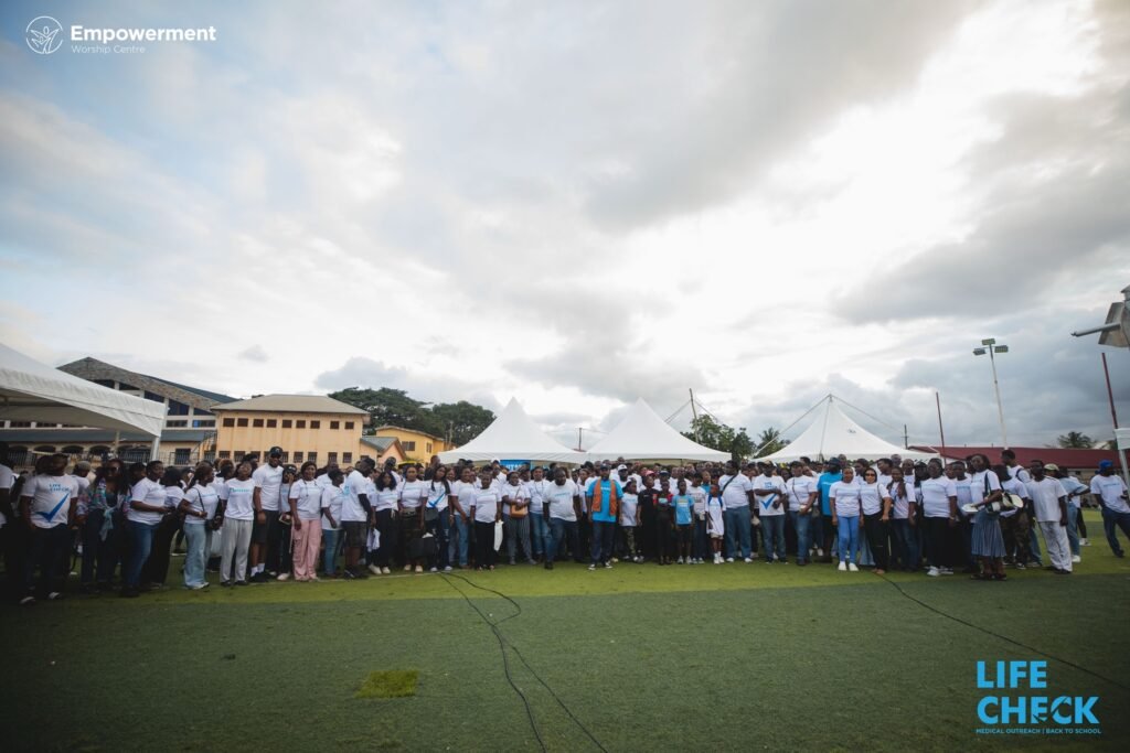 Wide shot of the LifeCheck 2025 team and crowd on the field